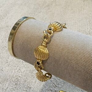 Vintage gold plated textured puffy link bracelet with black rhinestone accents